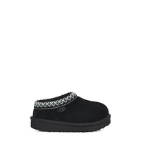 Black slipper with patterned band on a white background