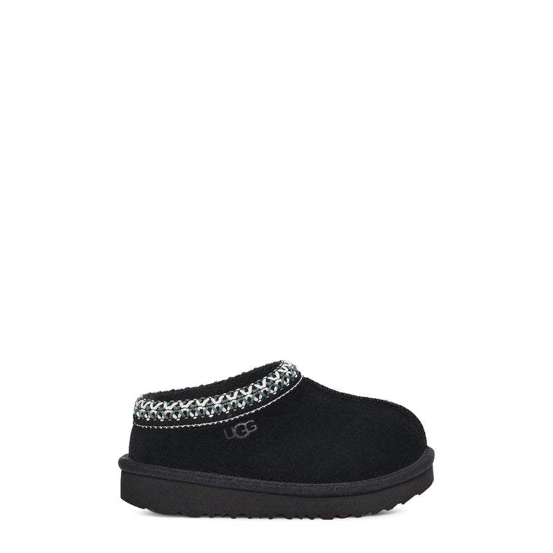 Black slipper with patterned band on a white background