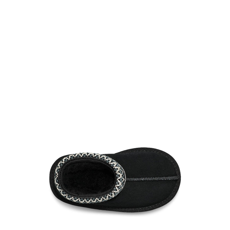 Black slipper with white trim on a white background
