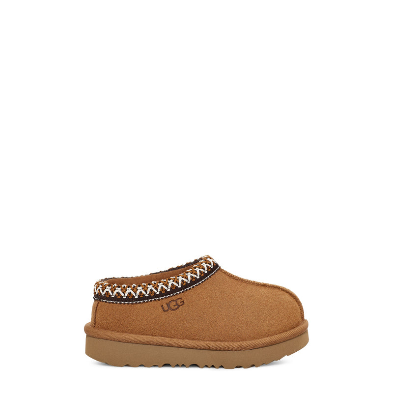 Brown slipper with decorative band on a white background
