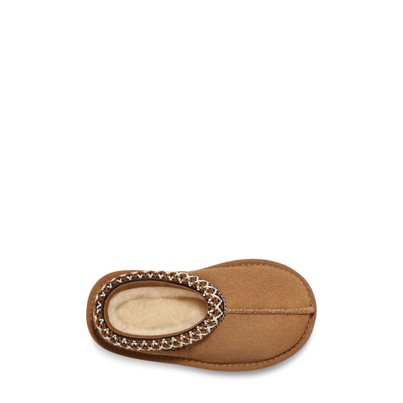 Brown baby shoe with a decorative sole on a white background