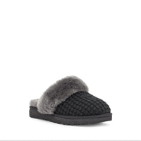 Black slipper with fuzzy trim on a white background